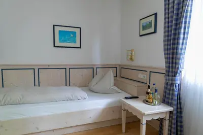 Ein Bett oder Betten in einem Zimmer der Unterkunft Fischerstüberl Attel