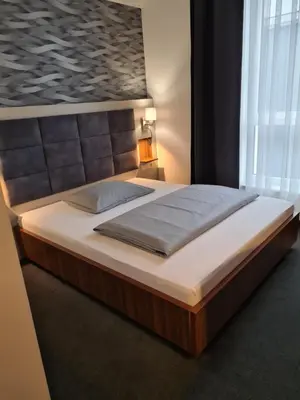 Ein Bett oder Betten in einem Zimmer der Unterkunft Hotel Starton am Ingolstadt Village