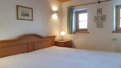 Ein Bett oder Betten in einem Zimmer der Unterkunft Ferienwohnungen Budererhof