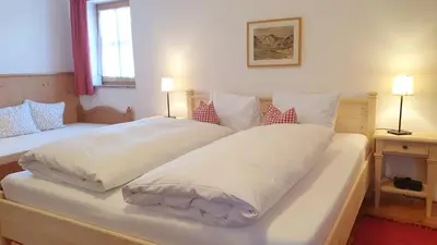 Ein Bett oder Betten in einem Zimmer der Unterkunft Ferienwohnungen Budererhof