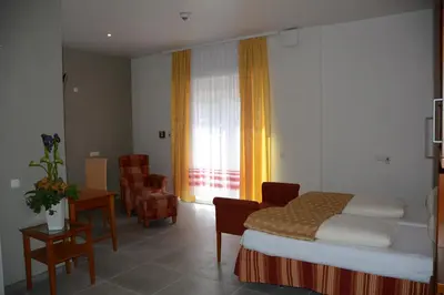 Ein Bett oder Betten in einem Zimmer der Unterkunft Alpina home