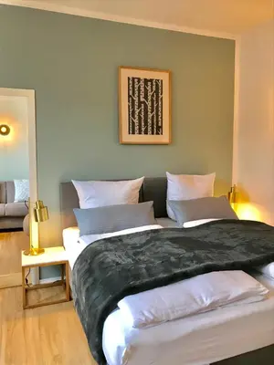 Ein Bett oder Betten in einem Zimmer der Unterkunft Hotel Garni Goldammer