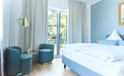 Ein Bett oder Betten in einem Zimmer der Unterkunft Hotel Garni Goldammer