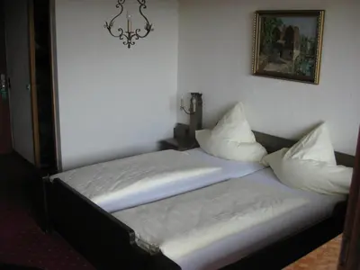 Ein Bett oder Betten in einem Zimmer der Unterkunft Panoramahotel Karwendelhof