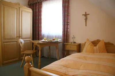 Ein Bett oder Betten in einem Zimmer der Unterkunft Landgasthof Stangl