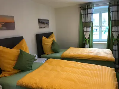 Ein Bett oder Betten in einem Zimmer der Unterkunft Gästehaus Sarker