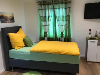 Ein Bett oder Betten in einem Zimmer der Unterkunft Gästehaus Sarker