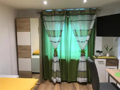 Ein Bett oder Betten in einem Zimmer der Unterkunft Gästehaus Sarker