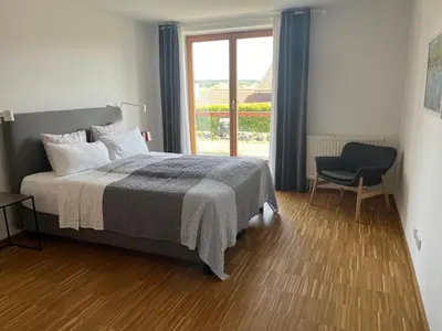 Ein Bett oder Betten in einem Zimmer der Unterkunft Truchtling Appartements