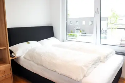 Ein Bett oder Betten in einem Zimmer der Unterkunft Das Fischer Boardinghouse BW