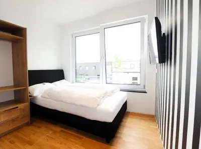 Ein Bett oder Betten in einem Zimmer der Unterkunft Das Fischer Boardinghouse BW
