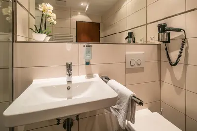Ein Badezimmer in der Unterkunft Hotel am Krone Park