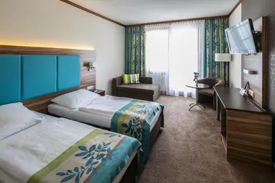 Ein Bett oder Betten in einem Zimmer der Unterkunft Hotel am Krone Park