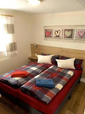 Ein Bett oder Betten in einem Zimmer der Unterkunft Allgäu-Chalet