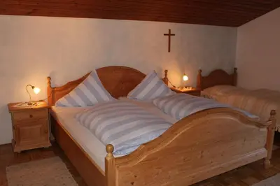 Ein Bett oder Betten in einem Zimmer der Unterkunft Schwaigerhof