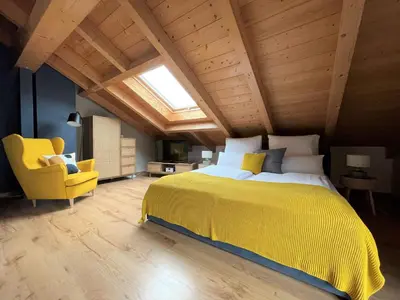 Ein Bett oder Betten in einem Zimmer der Unterkunft Das Bergquartier - Ferienwohnung Mühlberg
