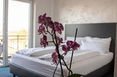 Ein Bett oder Betten in einem Zimmer der Unterkunft Sporthotel Neuburg