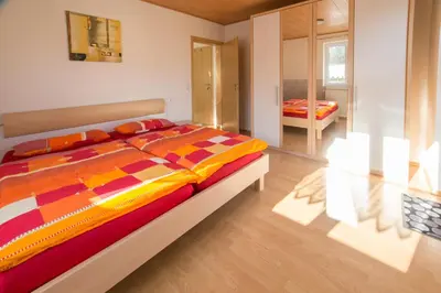 Ein Bett oder Betten in einem Zimmer der Unterkunft Ferienhaus Regina