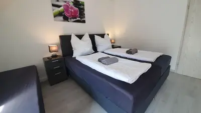 Ein Bett oder Betten in einem Zimmer der Unterkunft Neuburg Ferienwohnung am Schloss
