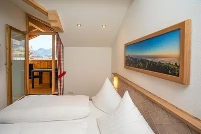 Ein Bett oder Betten in einem Zimmer der Unterkunft Chiemsee Hauszeit
