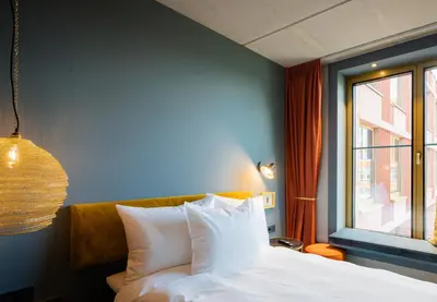 Ein Bett oder Betten in einem Zimmer der Unterkunft gambino hotel WERKSVIERTEL