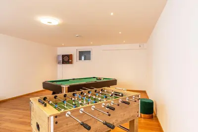 Eine Spielezimmer in der Unterkunft Chiemgauferienwohnungen - Maier