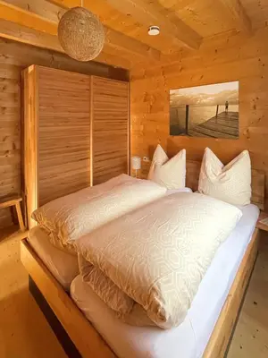 Ein Bett oder Betten in einem Zimmer der Unterkunft Chalet Chiemgau