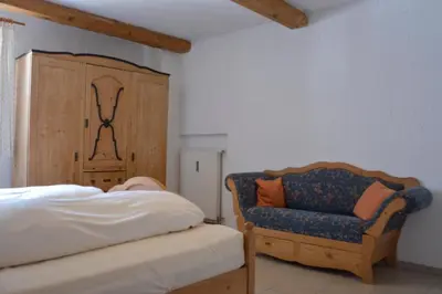 Ein Bett oder Betten in einem Zimmer der Unterkunft Ferienhof Mühlthal