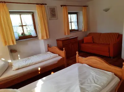 Ein Bett oder Betten in einem Zimmer der Unterkunft Ferienhof Mühlthal