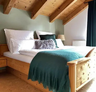 Ein Bett oder Betten in einem Zimmer der Unterkunft Das Bergquartier - Ferienwohnung Krottenkopf