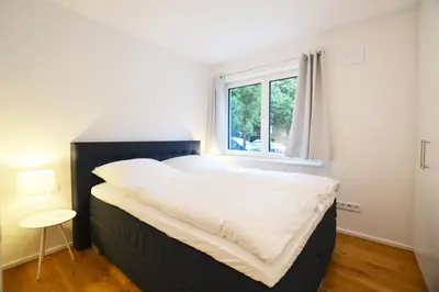 Ein Bett oder Betten in einem Zimmer der Unterkunft Modern apartment near downtown