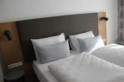 Ein Bett oder Betten in einem Zimmer der Unterkunft Hotel Brunnthal