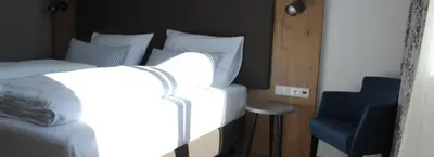 Ein Bett oder Betten in einem Zimmer der Unterkunft Hotel Brunnthal