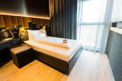 Ein Bett oder Betten in einem Zimmer der Unterkunft MY HOME MY HOTEL Rosenheim
