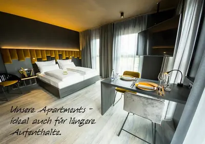 Ein Bett oder Betten in einem Zimmer der Unterkunft MY HOME MY HOTEL Rosenheim
