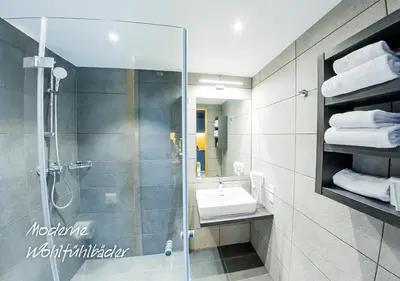 Ein Badezimmer in der Unterkunft MY HOME MY HOTEL Rosenheim