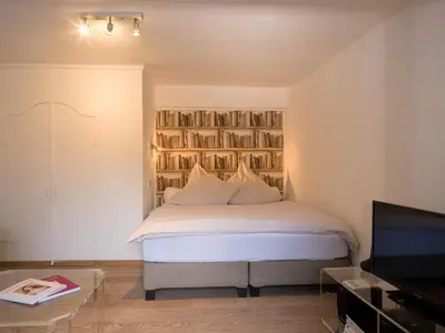 Ein Bett oder Betten in einem Zimmer der Unterkunft Ferienwohnungen Schnabel im Herzen von Rottach-Egern