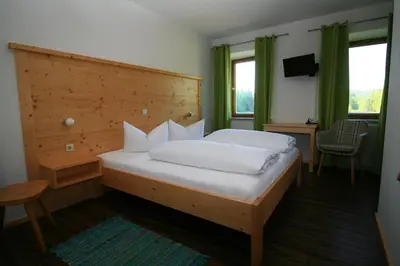 Ein Bett oder Betten in einem Zimmer der Unterkunft Landgasthof Auerschmiede