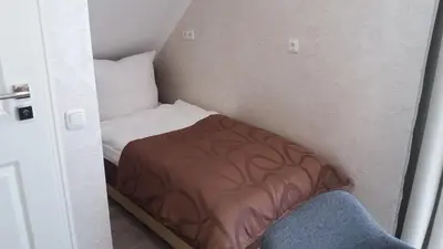 Ein Bett oder Betten in einem Zimmer der Unterkunft Müller Residenz Zur S-Bahn Karlsfeld