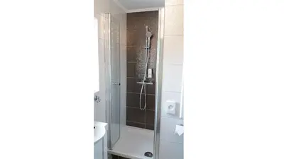 Ein Badezimmer in der Unterkunft Müller Residenz Zur S-Bahn Karlsfeld