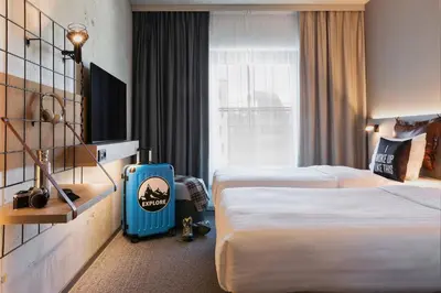 Ein Bett oder Betten in einem Zimmer der Unterkunft Moxy Munich Ostbahnhof