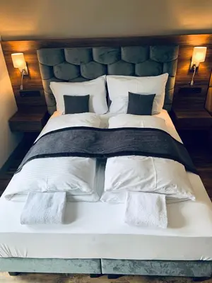 Ein Bett oder Betten in einem Zimmer der Unterkunft Intergroup Business & Design Hotel Ingolstadt