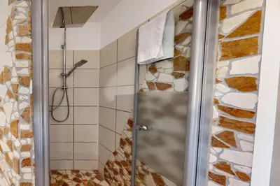 Ein Badezimmer in der Unterkunft Alberta*****