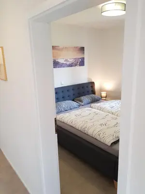 Ein Bett oder Betten in einem Zimmer der Unterkunft Ferienwohnung Schloßberg 1