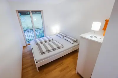Ein Bett oder Betten in einem Zimmer der Unterkunft Gastl Ferienwohnung und Bootsverleih