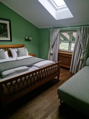 Ein Bett oder Betten in einem Zimmer der Unterkunft Hotel Leeberghof