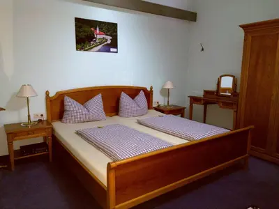 Ein Bett oder Betten in einem Zimmer der Unterkunft Hotel Fortuna