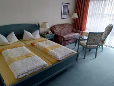 Ein Bett oder Betten in einem Zimmer der Unterkunft Hotel Fortuna