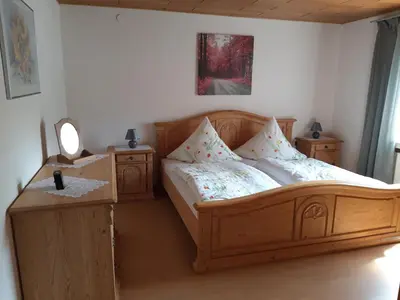 Ein Bett oder Betten in einem Zimmer der Unterkunft Hermine´s Ferienwohnung