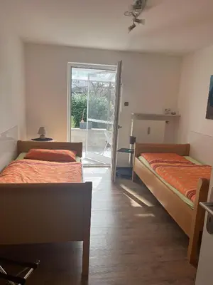Ein Bett oder Betten in einem Zimmer der Unterkunft Ferienwohnung Niedermoosen